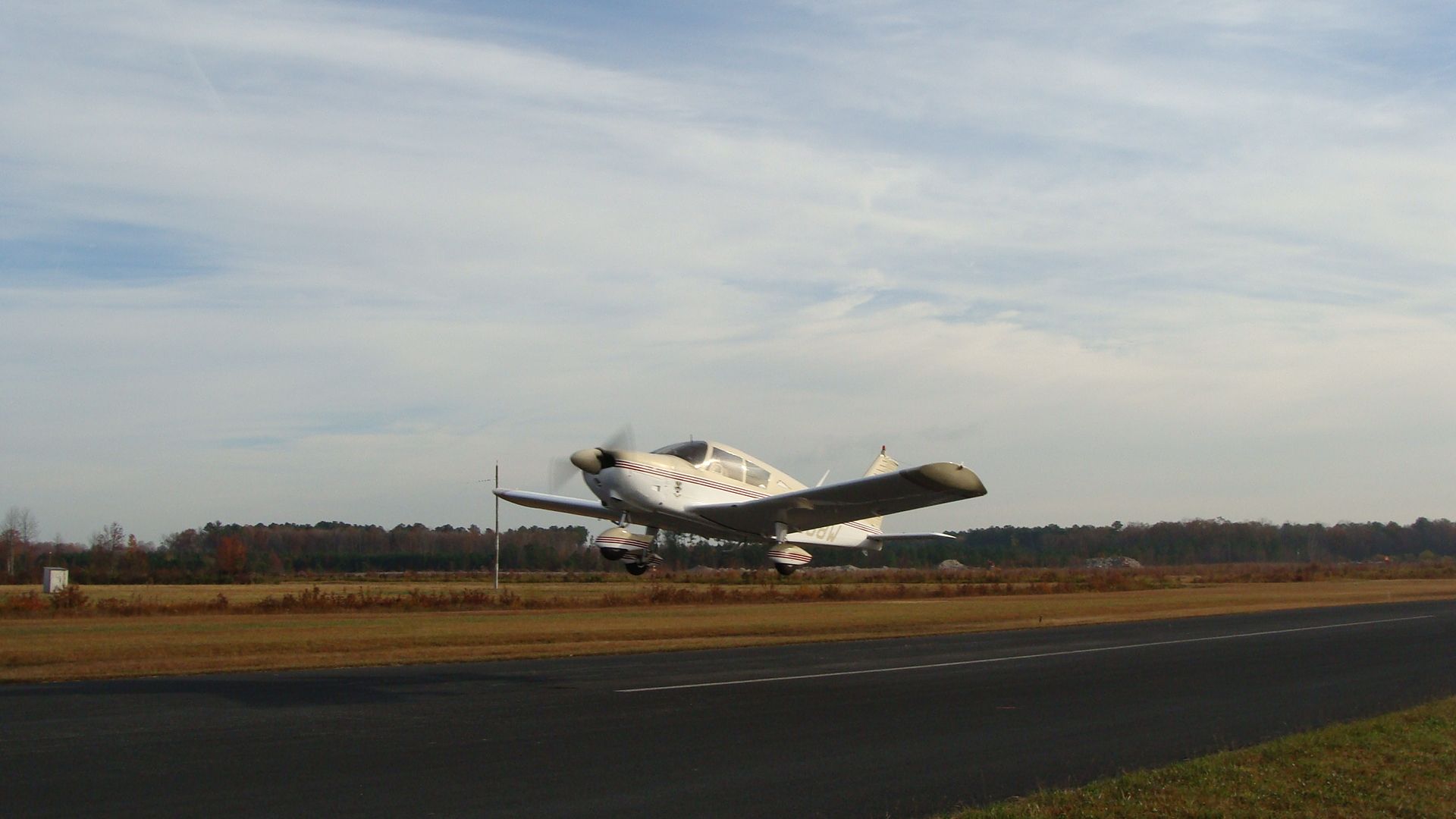 N8368W - Piper Cherokee 180 just airborne over the runway